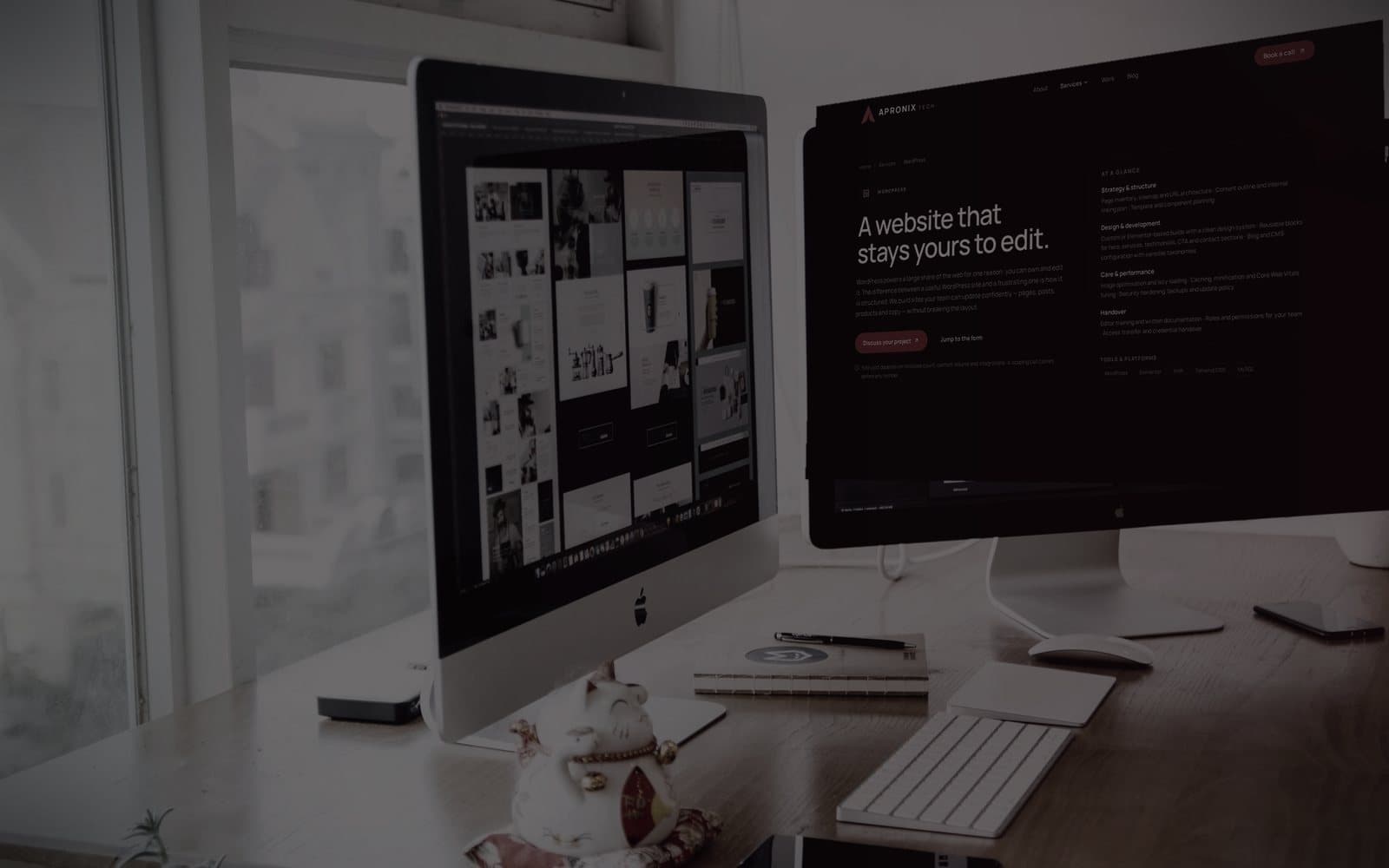 Two displays in a studio, one showing the Apronix WordPress service page